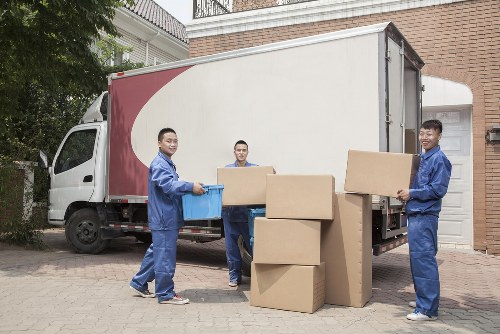 Removal team loading household items into a moving van