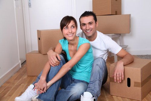 Removal team handling furniture in a Maida Vale property