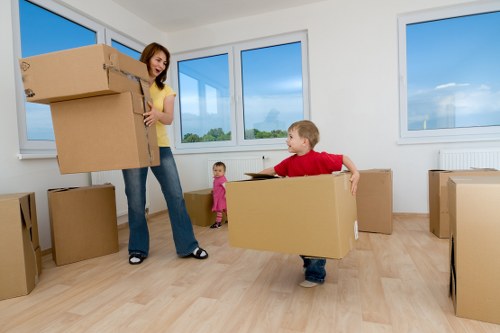 Professional movers handling household items with care during a London relocation