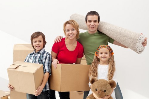 Professional movers handling fragile belongings during relocation