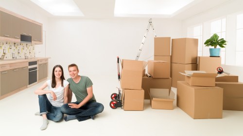 Professional removal team handling boxes and furniture in Maida Vale